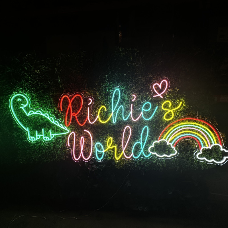 Richie’s World — LED neon sign with dinosaur (text + icon)